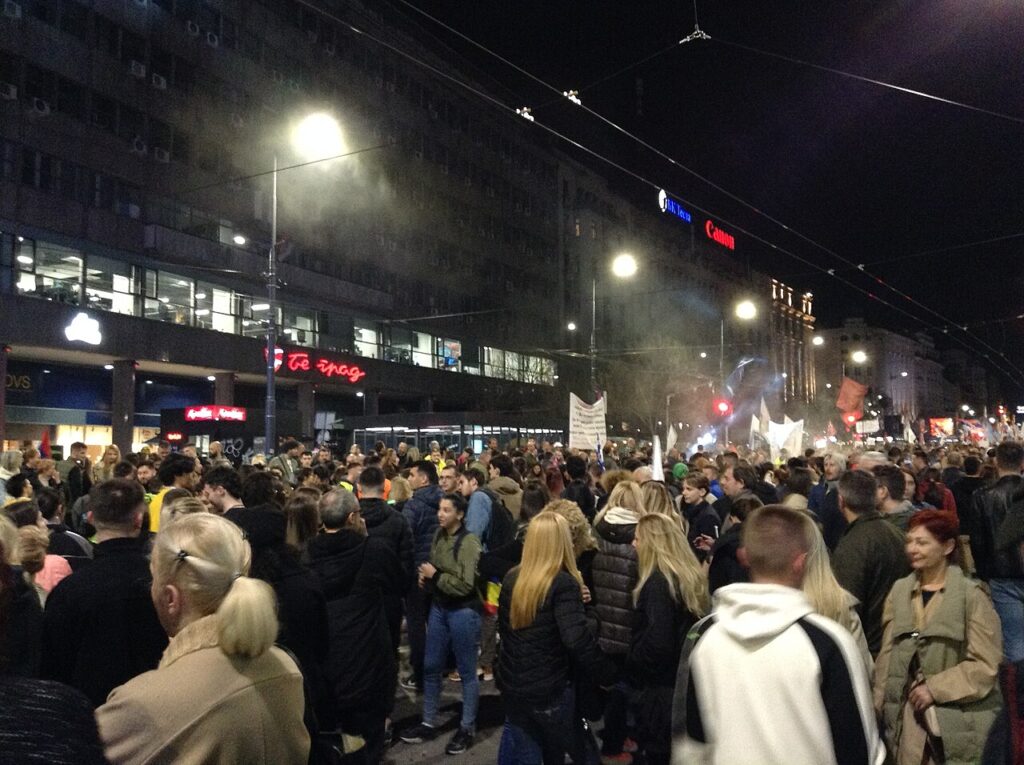 A large crowd of students and supporters fills a Belgrade street at night during the student protest movement, March 2025