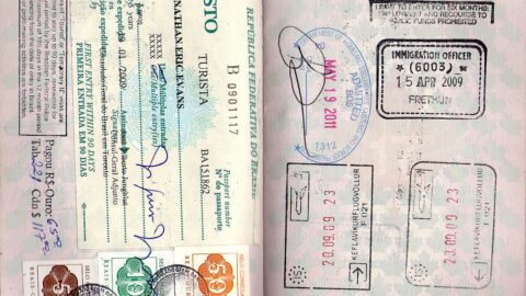 Passport pages with entry stamps from Brazil, Iceland, the UK and the United States.