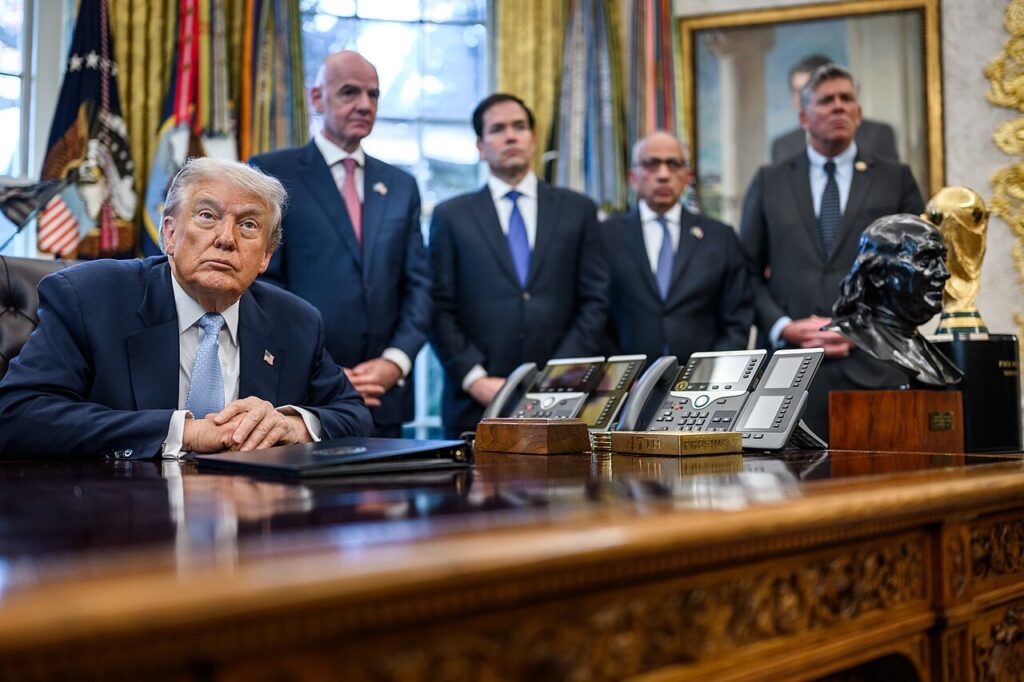 US President Donald Trump answers questions from reporters in the Oval Office, November 17, 2025
