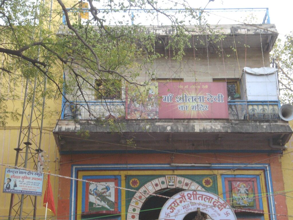 Entrance of the Sheetla Mata Temple in Gwalior, Madhya Pradesh, India, with the temple's Hindi signboard