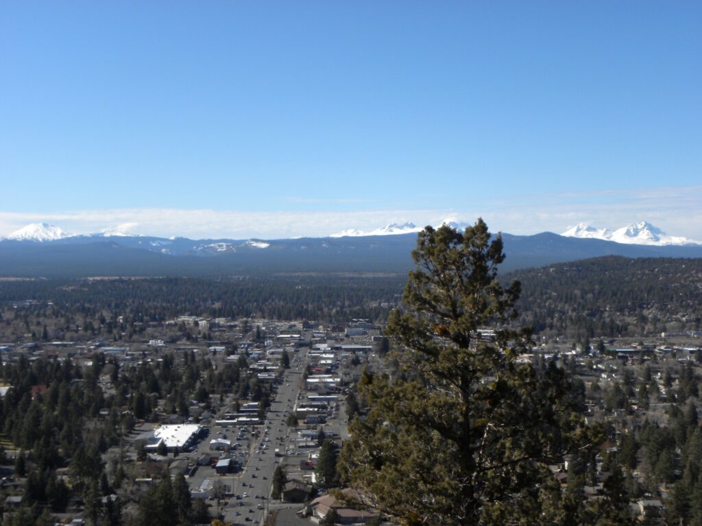 Downtown Bend, Oregon, seen from Pilot Butte, with the Cascade mountains behind the city