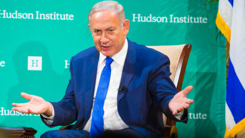 Benjamin Netanyahu gesturing while speaking at a Hudson Institute event