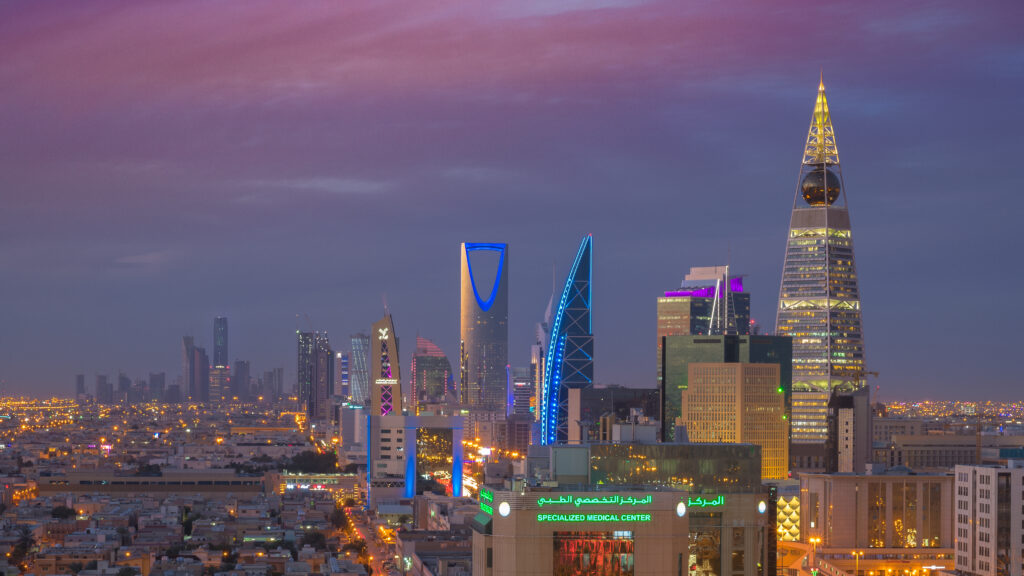 Riyadh's night skyline with the Al Faisaliyah Tower and Kingdom Centre Tower — Riyadh, Saudi Arabia, where falling debris from intercepted missiles damaged a kindergarten and a medical complex on October 8, 2026.