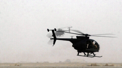 Two US Army AH-6J Little Bird reconnaissance helicopters in flight over Iraq in 2003 — the same aircraft family as the Saudi AH-6i that crashed in Najran