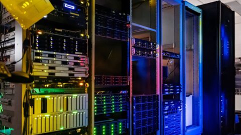Rows of server racks in a data center, the kind of hardware an AI inference engine like DeepInfer runs on
