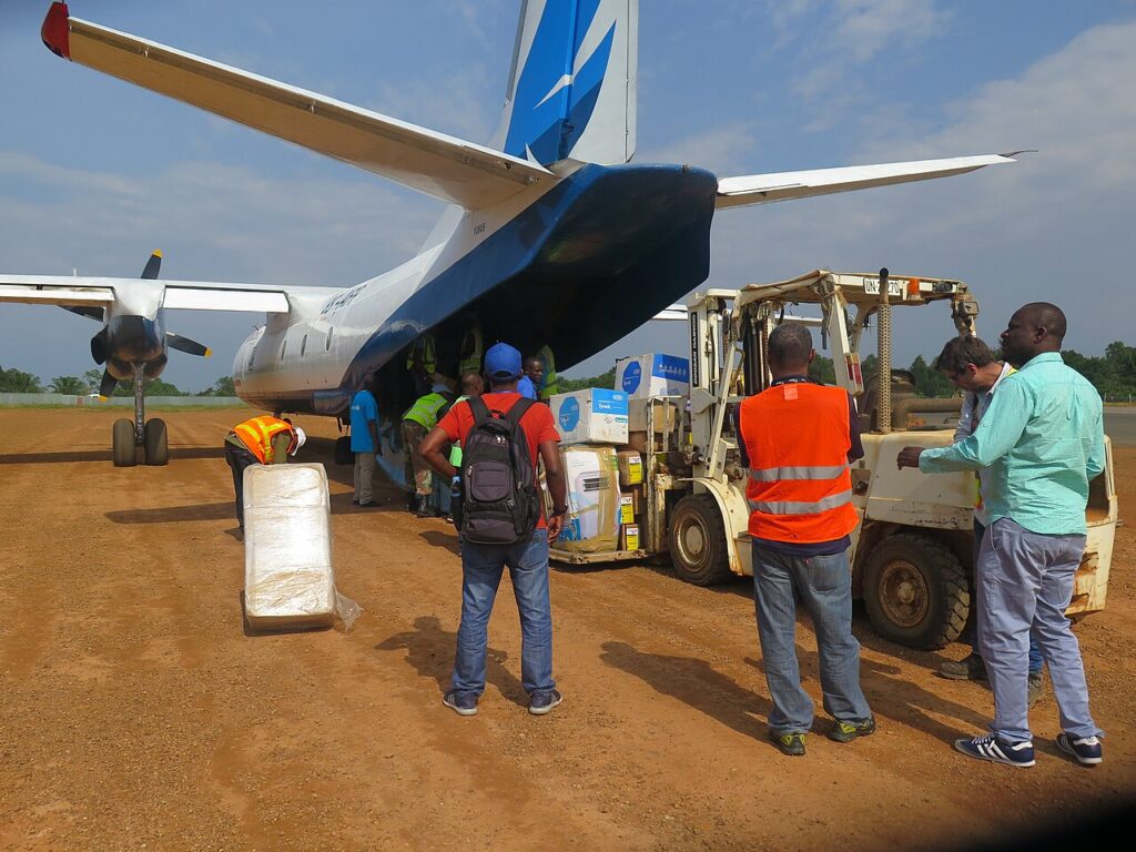 UN workers unload medical supplies from an aircraft in Beni, DR Congo, during the Ebola response.