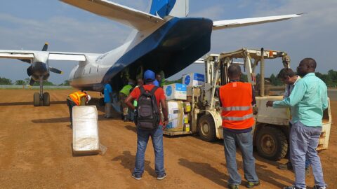 UN workers unload medical supplies from an aircraft in Beni, DR Congo, during the Ebola response.