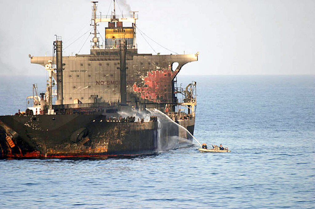 US Navy sailors fight a fire aboard the burning crude oil tanker MV Everton