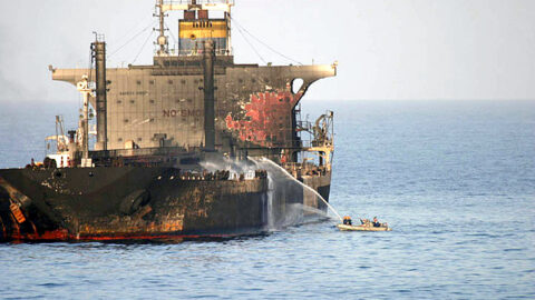 US Navy sailors fight a fire aboard the burning crude oil tanker MV Everton