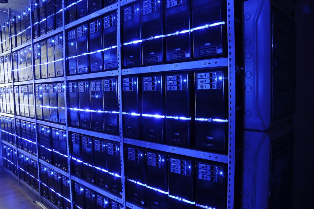 Rows of server racks with blue indicator lights in a data centre