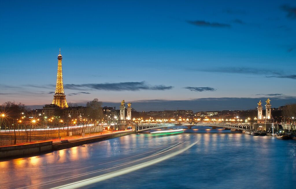 Eiffel Tower lit up at night in Paris