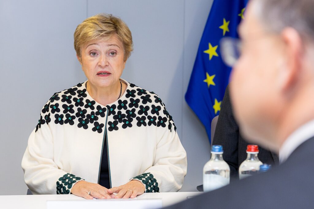 Kristalina Georgieva, Managing Director of the International Monetary Fund, seated at a table during her visit to the European Commission, with an EU flag behind her
