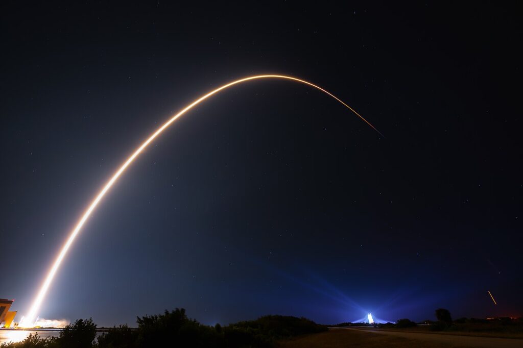 Long-exposure arc of a Falcon 9 rocket launch at night, Cape Canaveral