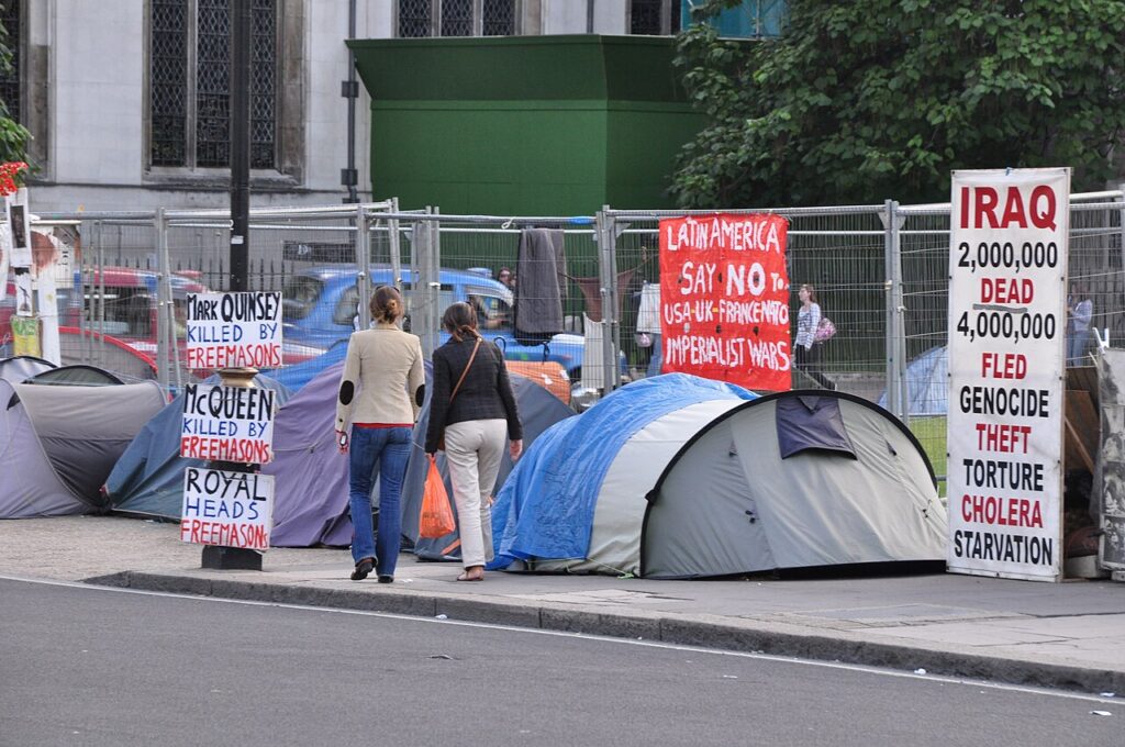 Protesters with signs at Westminster, London (file photo)