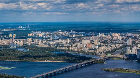Aerial view of Kyiv, Ukraine, with bridges crossing the Dnipro River