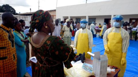 Healthcare workers model full personal protective equipment during Ebola response training — file photo.