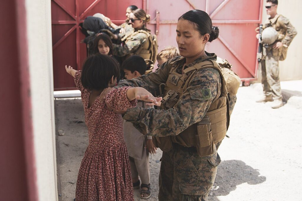 Afghan evacuees arriving at an evacuation control centre at Kabul airport in August 2021.