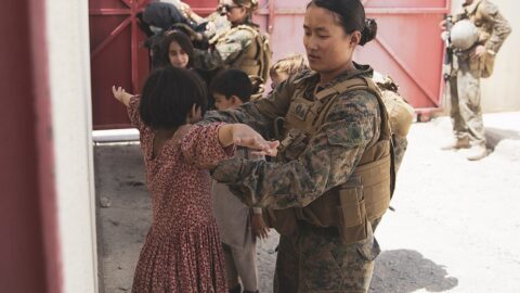 Afghan evacuees arriving at an evacuation control centre at Kabul airport in August 2021.