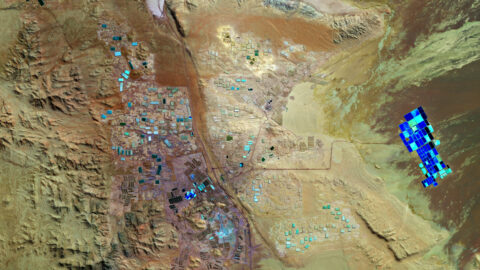 Aerial view of blue lithium brine evaporation ponds in the Atacama Desert