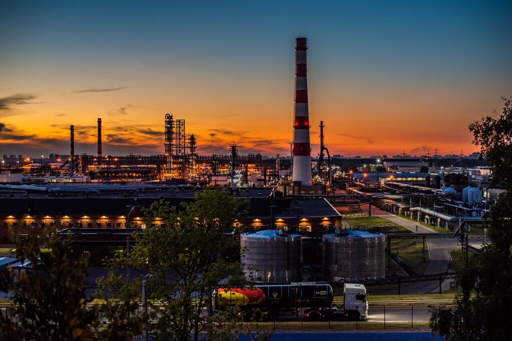 A large Russian oil refinery with distillation towers and storage tanks.