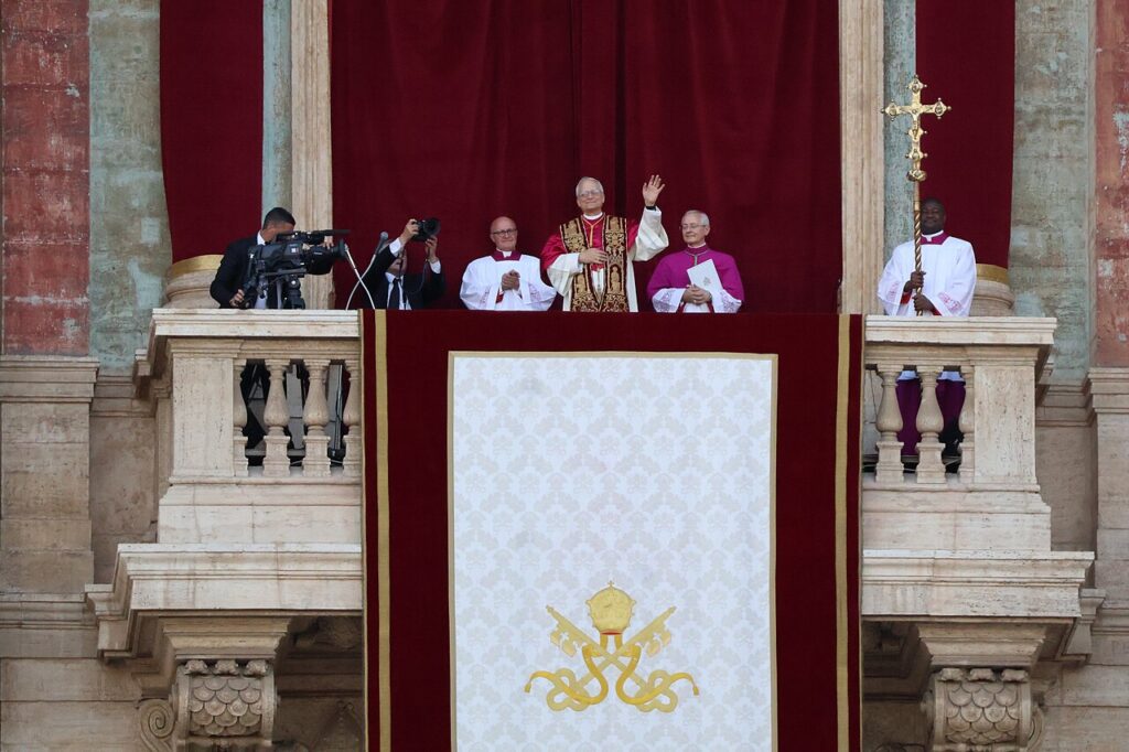 Pope Leo XIV waving from the balcony of St. Peter's Basilica after his election in May 2025.