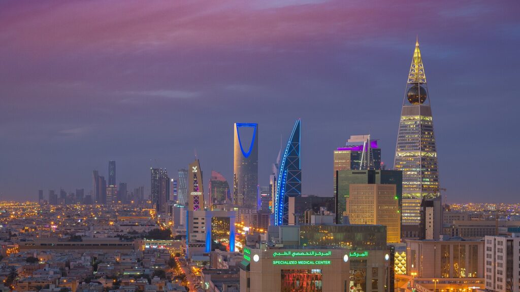 The Riyadh skyline at night, with the Kingdom Centre tower lit up