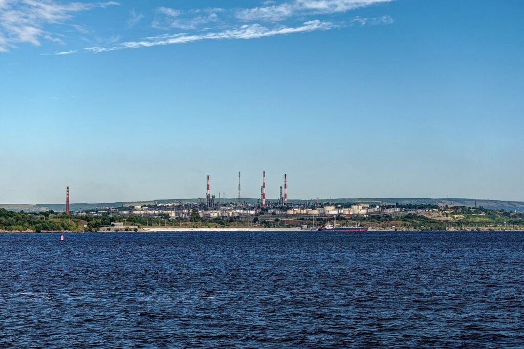Oil refinery towers and chimneys beside the Volga river in Russia.