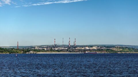 Oil refinery towers and chimneys beside the Volga river in Russia.