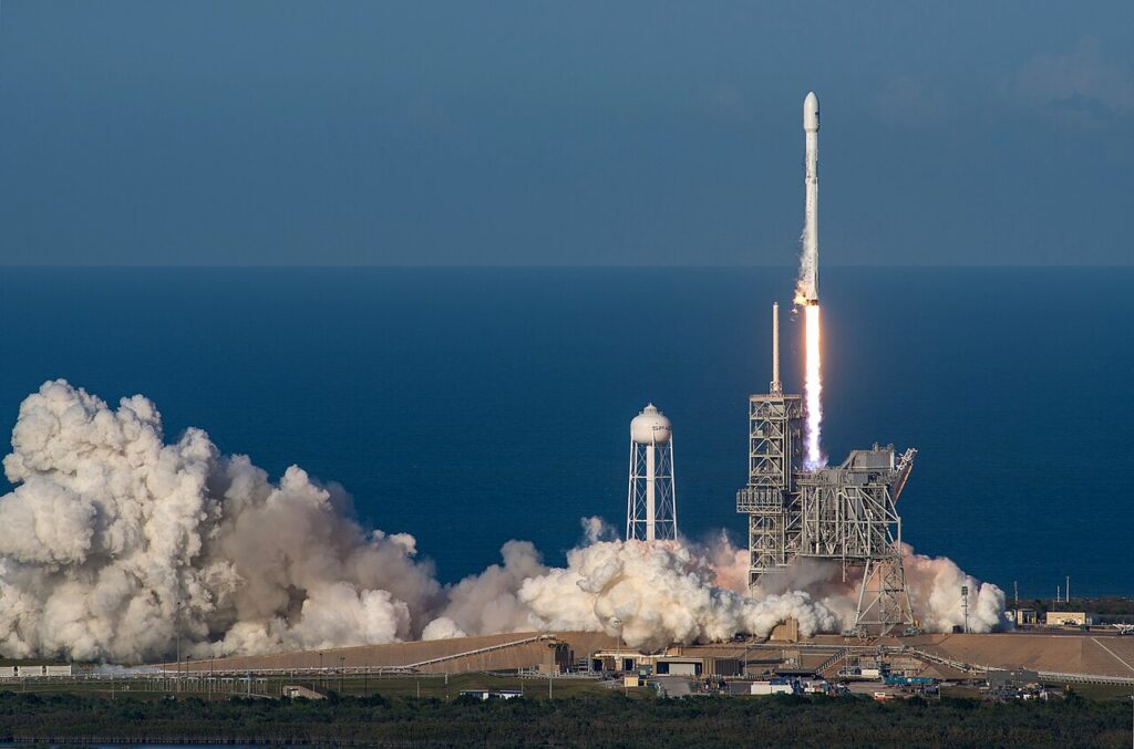 A SpaceX Falcon 9 rocket launching from Kennedy Space Center's Pad 39A