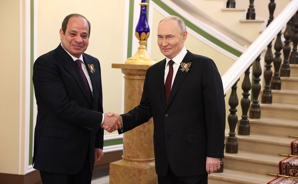 Egyptian President Abdel Fattah el-Sisi shaking hands with Russian President Vladimir Putin in Moscow, May 2025