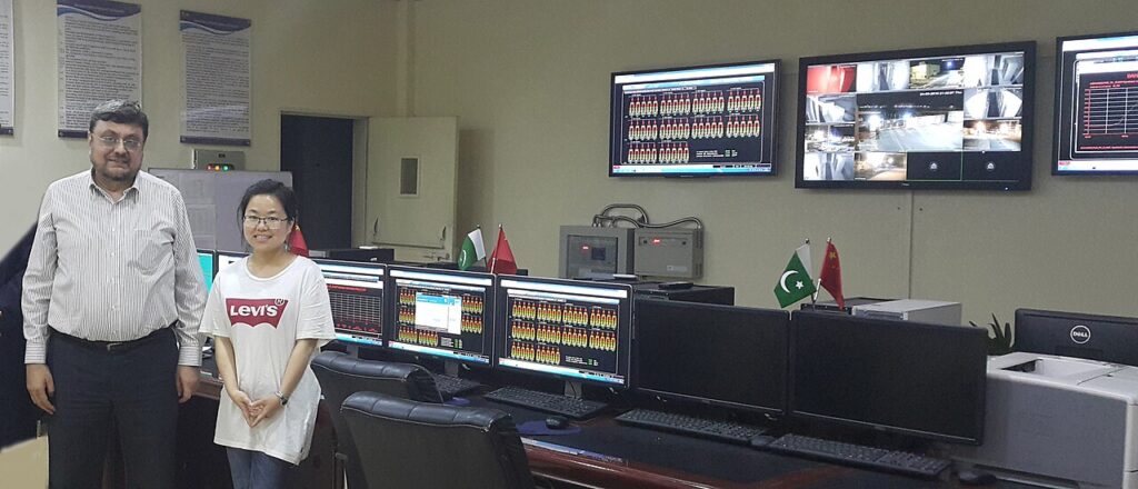 An industrial control room with monitoring screens at a solar power plant