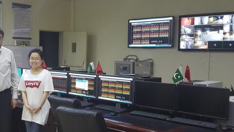 An industrial control room with monitoring screens at a solar power plant