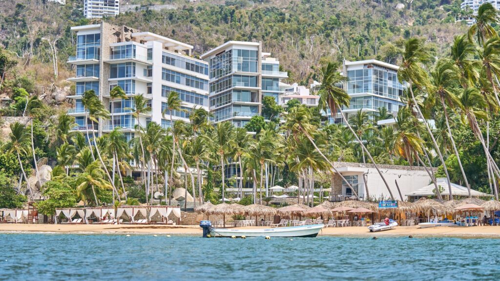 Beachfront hotels and palm trees along the Pacific coast at Acapulco, Mexico, as Hurricane Trudy approaches the region
