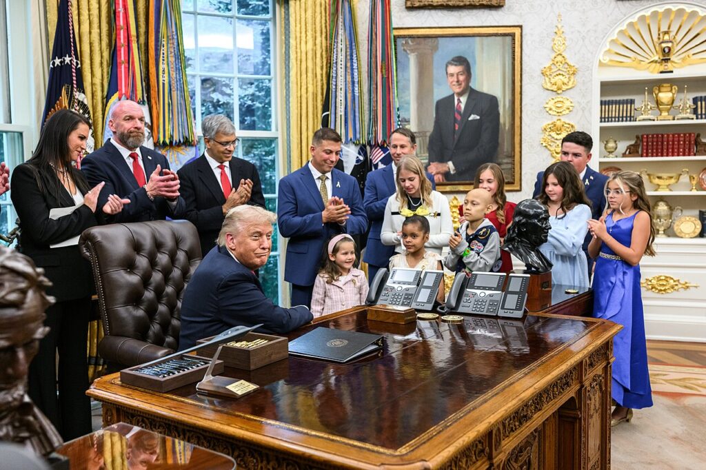 President Donald Trump signs an executive order at the White House