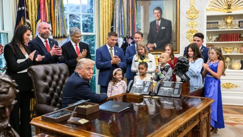 President Donald Trump signs an executive order at the White House