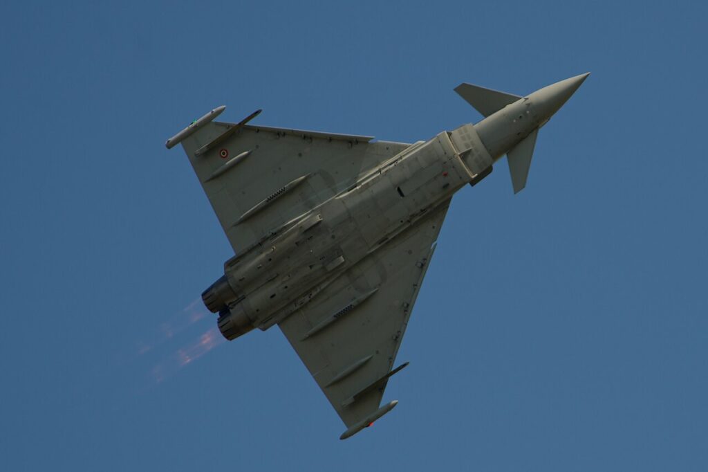 Italian Air Force Eurofighter Typhoon in flight against a blue sky