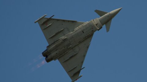 Italian Air Force Eurofighter Typhoon in flight against a blue sky