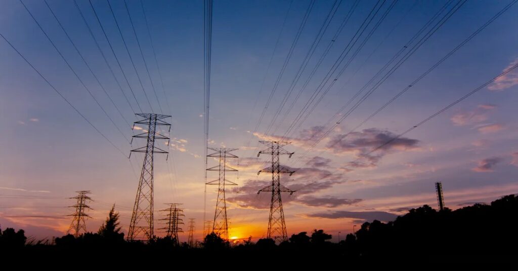 Electricity transmission pylons at dawn, Ukraine