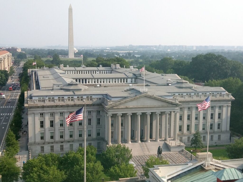The U.S. Treasury Building in Washington, D.C., with the Washington Monument behind