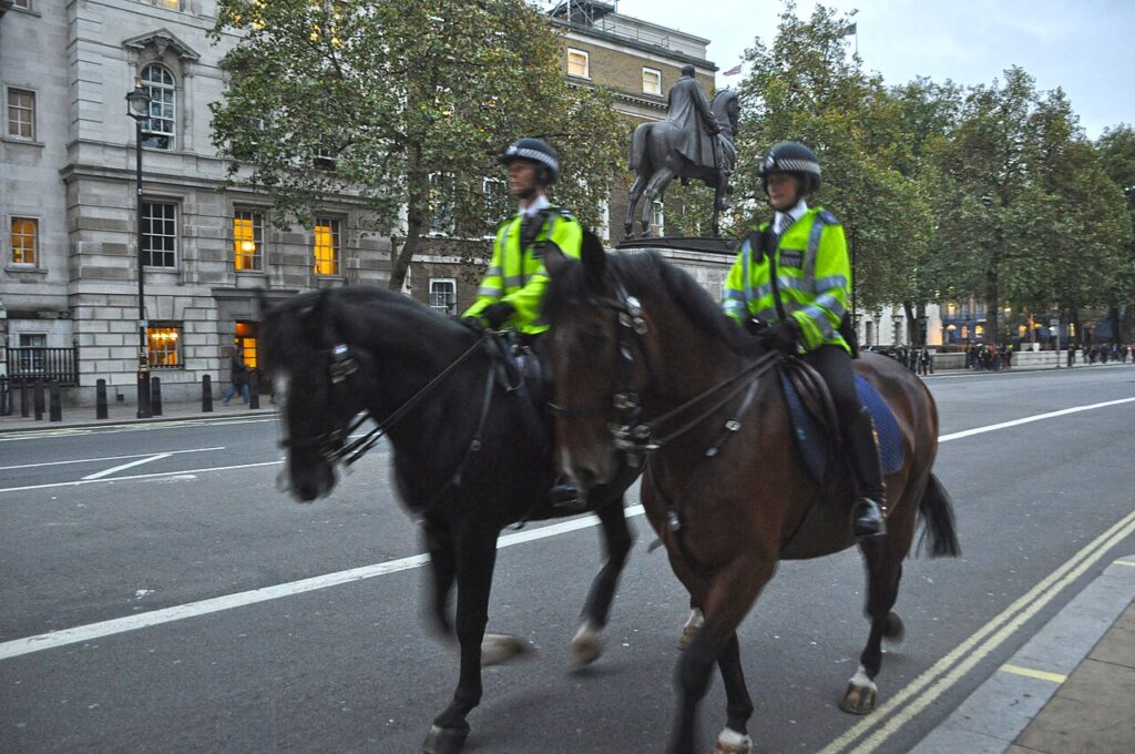 Whitehall, London street scene with mounted police officers