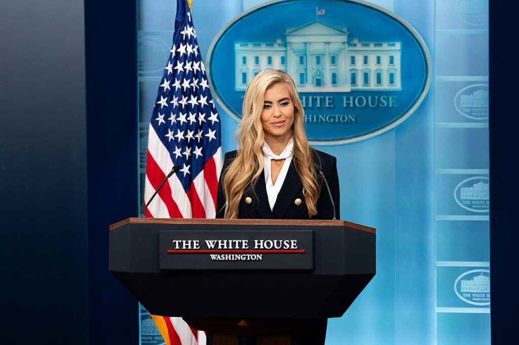 White House Press Secretary Katie Zacharia at the briefing room podium during her first press briefing, October 13, 2026.