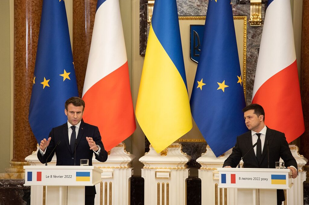 Ukrainian President Volodymyr Zelensky and French President Emmanuel Macron at podiums during a joint press conference in Kyiv.